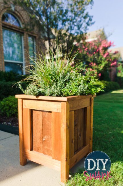 Different styles and sizes of DIY cedar planters.