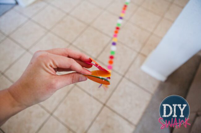 A tutorial on making DIY paper garland. Super easy, inexpensive decor idea for parties, baby showers or holidays!