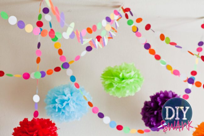 A tutorial on making DIY paper garland. Super easy, inexpensive decor idea for parties, baby showers or holidays!